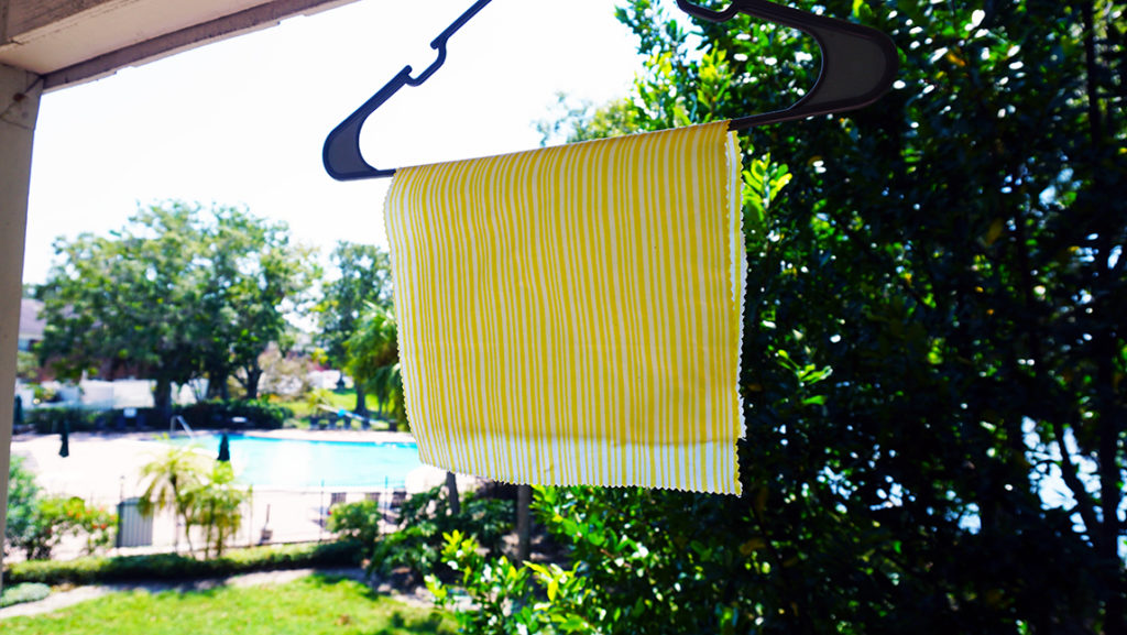 Hanging DIY Homemade Beeswax Wraps up to dry