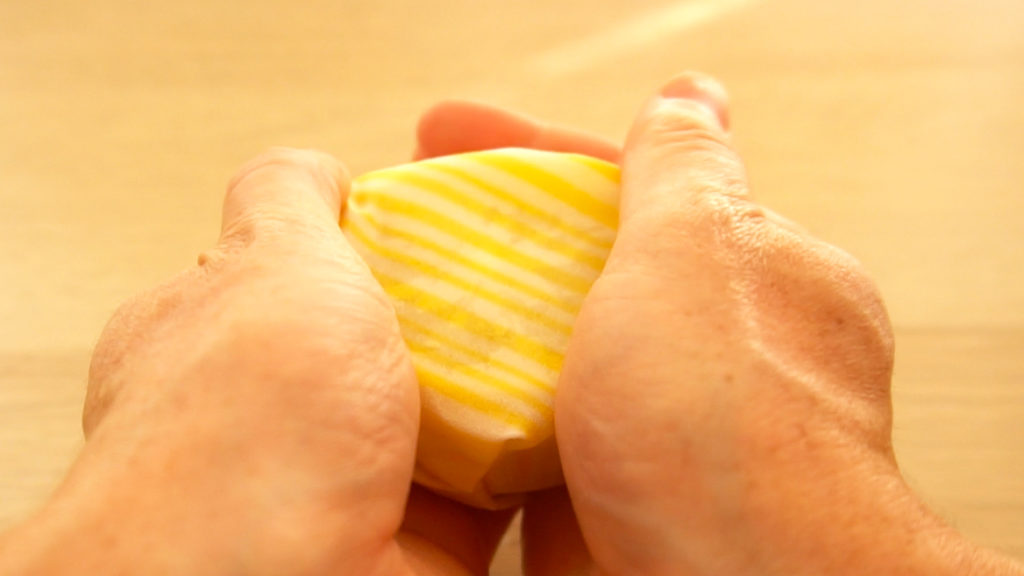 Wrapping a lemon with Beeswax Wraps Eco-Friendly alternative to Plastic Wrap